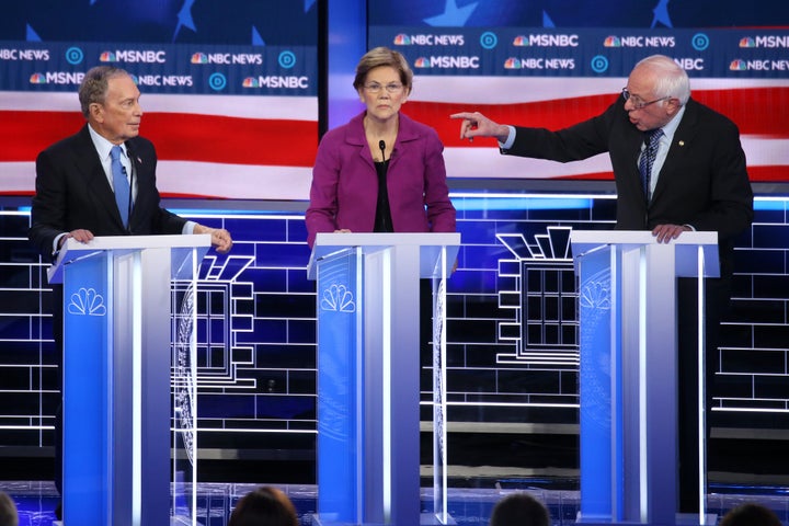 Sen. Bernie Sanders gestures at former New York City Mayor Mike Bloomberg as Sen. Elizabeth Warren listens during the Democratic presidential primary debate in Las Vegas on Feb. 19, 2020.