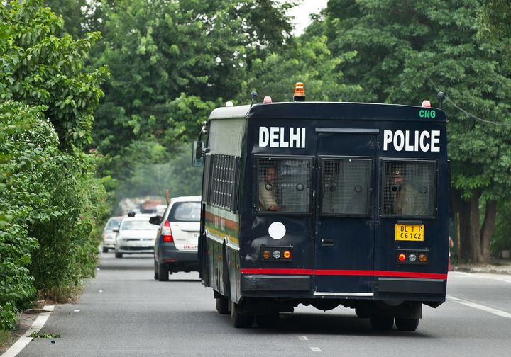 A police vehicle believed to be carrying the accused in a gangrape and murder case, leaves the Saket District Court following the verdict in New Delhi on September 10, 2013. 