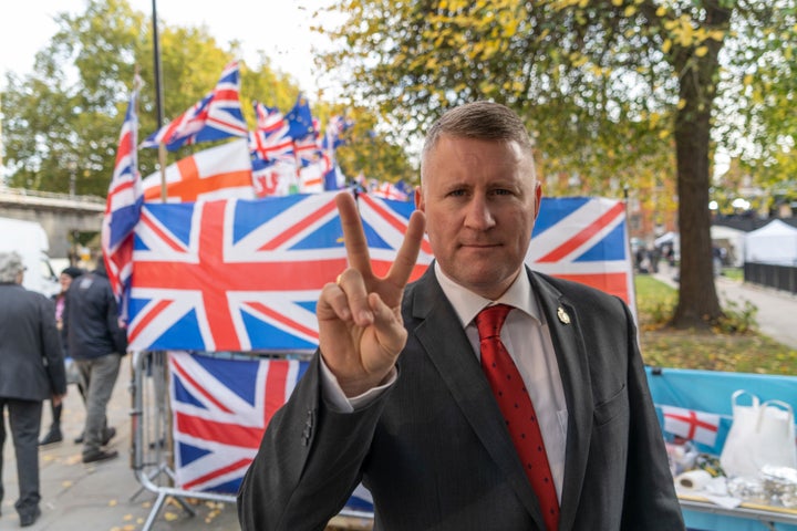 Paul Golding the leader of Britain First gestures outside the House of Parliament last year.