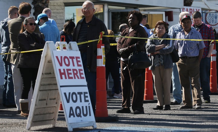 Nevadans wait on line to caucus on Tuesday, the last of four early caucus days. Bernie Sanders' performance in the caucuses is a test of competing unions' clout in the state.