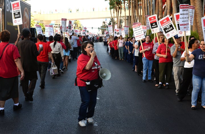 Culinary union members demonstrate outside The Cosmopolitan of Las Vegas in June 2013. The famously militant union is wary of jeopardizing its hard-fought gains.