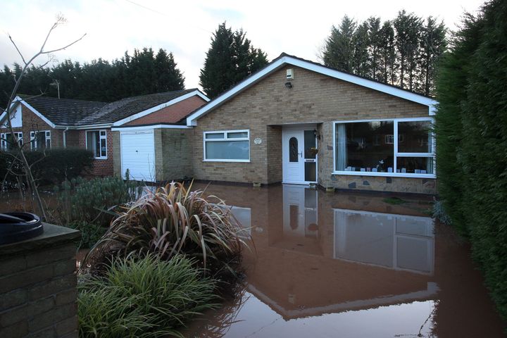 Flood water surrounds a house after the River Trent burst its banks, in Lowdham, Nottinghamshire.