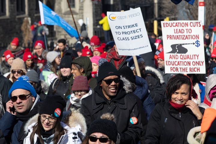 Protesters join a demonstration organized by teachers' unions outside the Ontario legislature in Toronto on Feb. 21, 2020. 