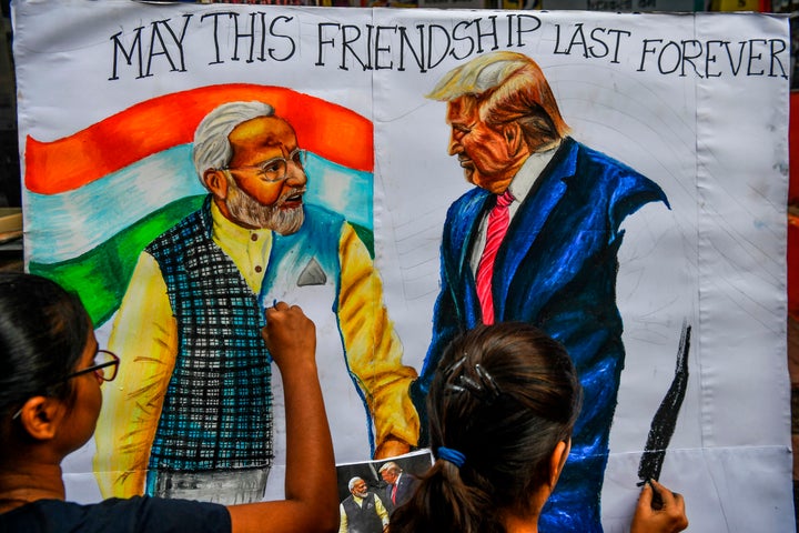 Students in Mumbai paint an image of President Donald Trump and Prime Minister Narendra Modi on Feb. 21, 2020, ahead of Trump's visit to India.