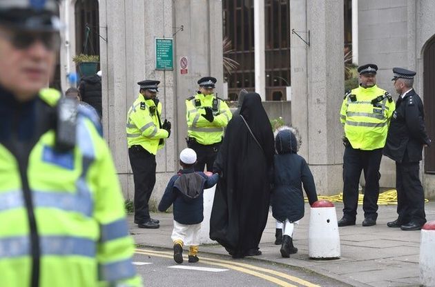 Worshippers arrive for midday prayers at the London Central Mosque