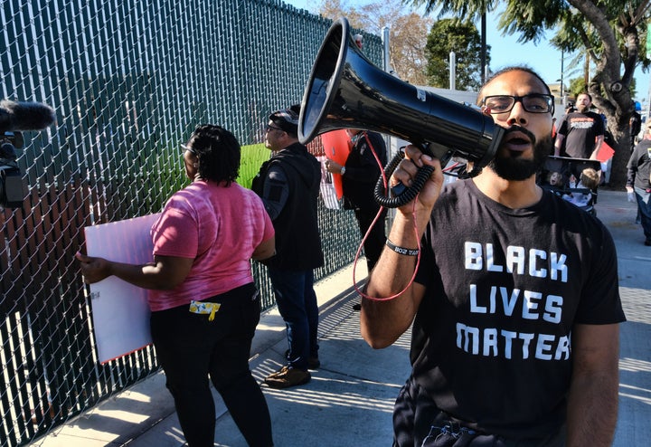 Demonstrators with Black Lives Matter protest a visit by Buttigieg to a homeless shelter in Los Angeles on Jan. 10, 2020.