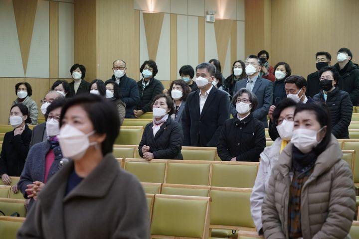 Christian faithful wearing masks to prevent contacting coronavirus pray during a service in Seoul, South Korea, February 23, 