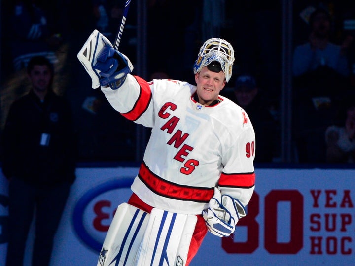 Carolina Hurricanes emergency goaltender David Ayres skates a lap after being named the game's first star.