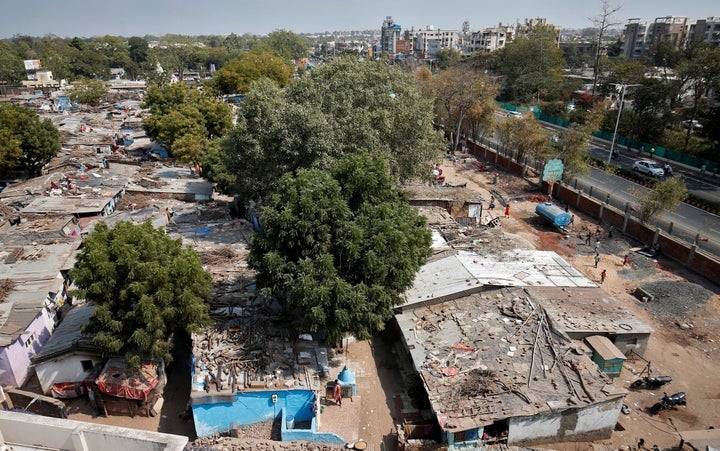 A view of a slum area where a wall was built as part of a beautification drive along a route that U.S. President Donald Trump and India's Prime Minister Narendra Modi will be taking during Trump's visit later.