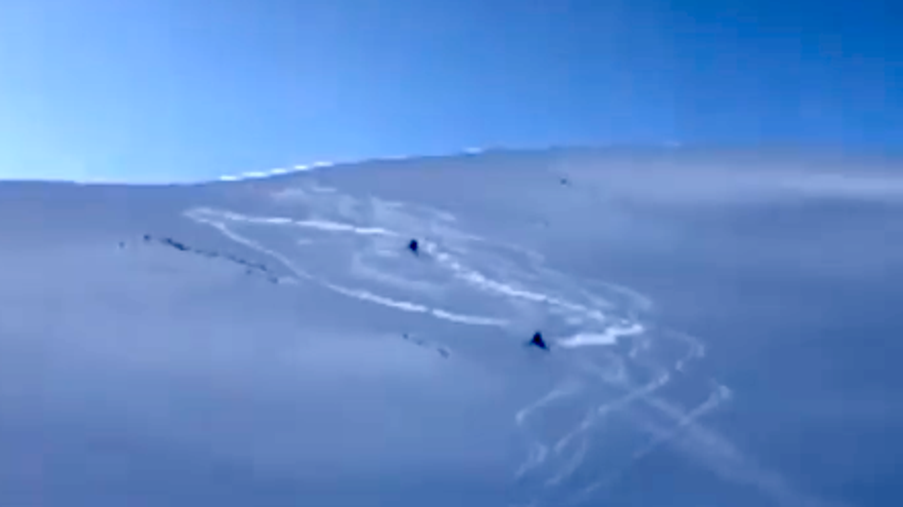 Video Shows Terrifying Moment Snowmobiler Is Swept Away By Avalanche