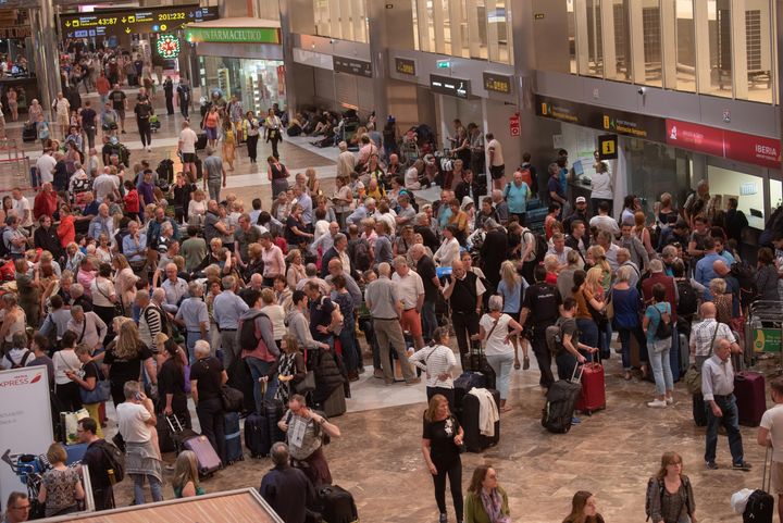 Passengers wait at Tenerife South Reina Sofia Airport.