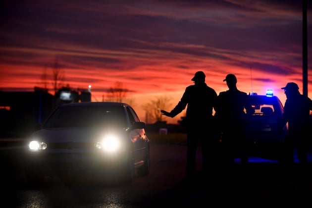 Police stops cars trying to enter or leave the cordoned area in Casalpusterlengo, northern Italy, on Sunday