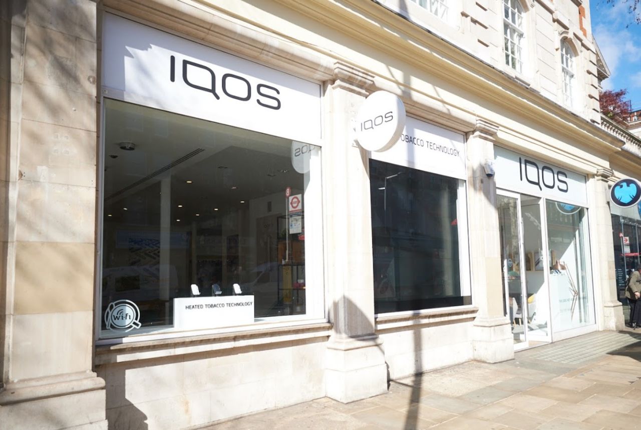 Iqos shops are sleek, with big museum-table cases.