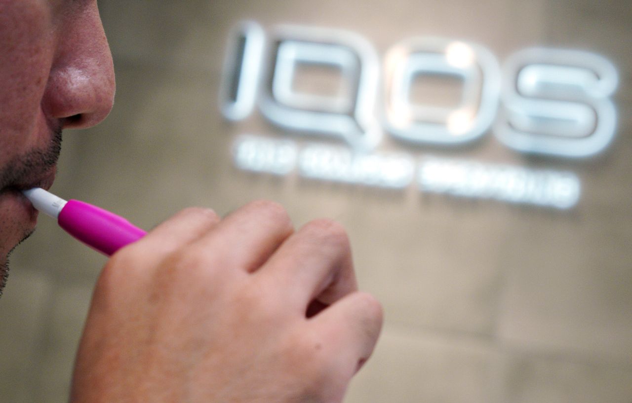 A user tries an Iqos product in Japan