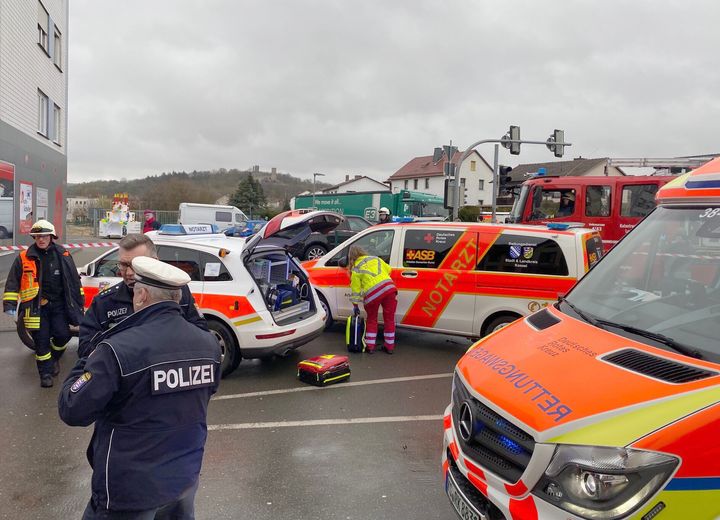 Fire brigades work close to the site where a car drove into a carnival procession in Volkmarsen near Kassel, central Germany.