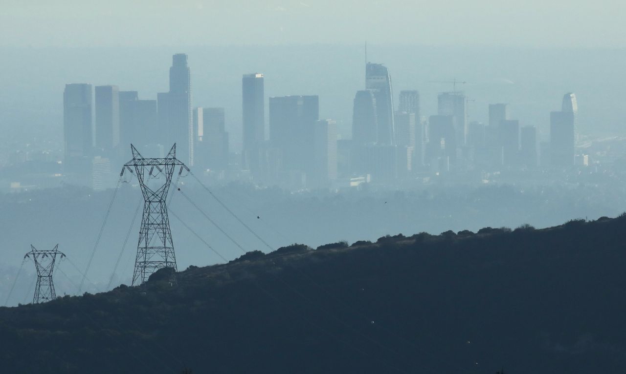 The buildings of downtown Los Angeles are partially obscured in the late afternoon on Nov. 5, 2019 as seen from Pasadena, California. 