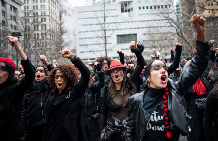 Women protest against rape while Harvey Weinstein attends a pretrial session on Jan. 10, 2020 in New York City. 