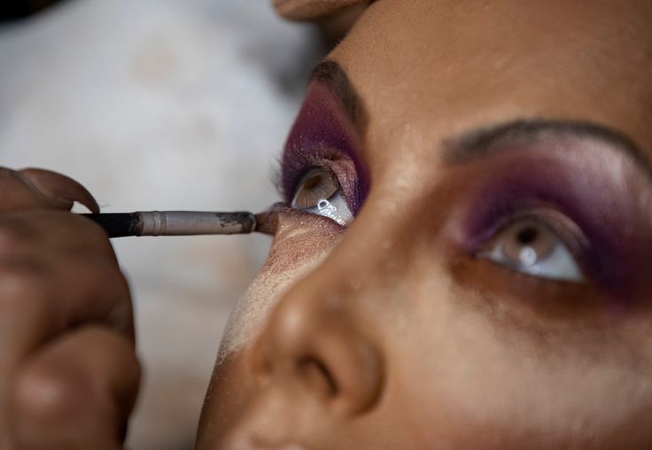 Camila Prins gets her make up done prior to performing for Colorado do Bras samba school in Sao Paulo, Brazil. 