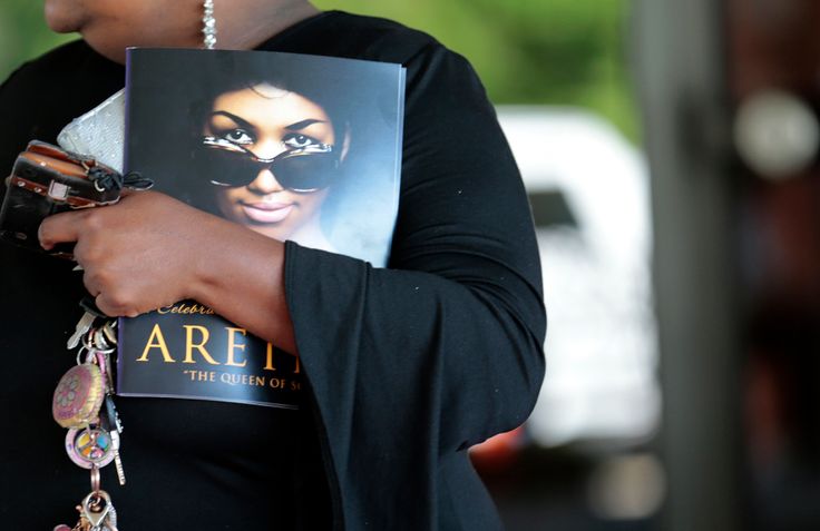 A mourner holds a program from Aretha Franklin's funeral at Detroit's Greater Grace Temple on Aug. 31, 2018.