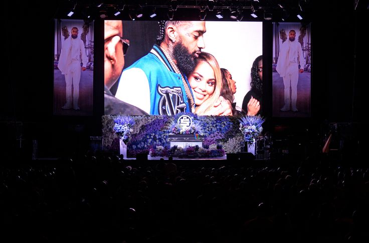 Photos are displayed during Nipsey Hussle's "Celebration of Life" on April 11, 2019, at Staples Center in Los Angeles. Nipsey Hussle was fatally shot in front of his store on March 31, 2019, in Los Angeles.