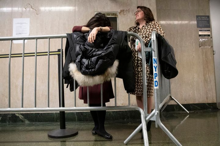 NBC News field producer Sumiko Moots, left, and CBS Network News producer Cassandra Gauthier wait in line to enter the courtroom during Harvey Weinstein's rape trial, Wednesday, Feb. 19, 2020, in New York.