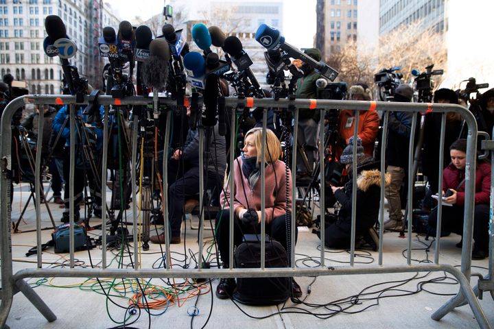 Rebecca Barry of ITV New waits for lawyers to come address the media after Harvey Weinstein left court for the day during jury deliberations in his rape trial, Friday, Feb. 21, 2020, in New York. 
