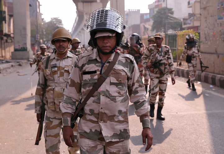 Paramilitary troops patrol in a riot affected area after clashes erupted between people demonstrating for and against a new citizenship law in New Delhi, India, February 25, 2020. REUTERS/Danish Siddiqui