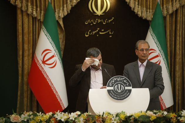 Iraj Harirchi, Iran's deputy health minister, wipes sweat from his face during a news conference on Monday in Tehran.