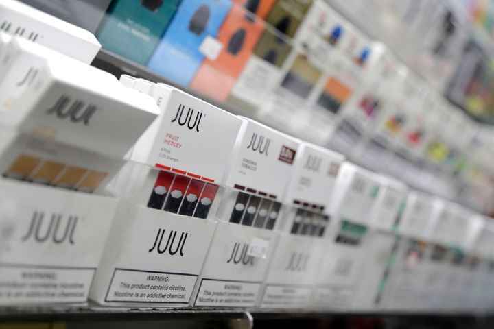 Juul products are displayed at a smoke shop in New York. The popular e-cigarette company has faced a number of lawsuits over its products and its use by children.