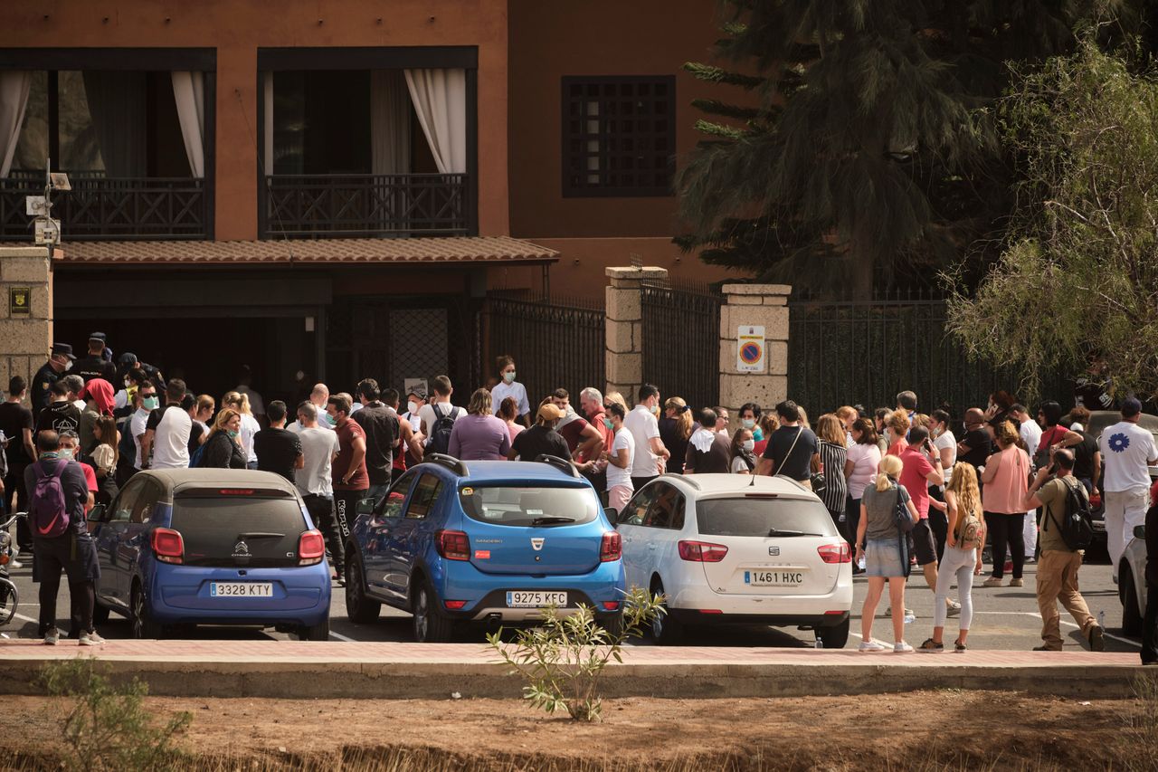 Hotel workers queue to get tested at the H10 Costa Adeje Palace hotel in the Canary Island of Tenerife.