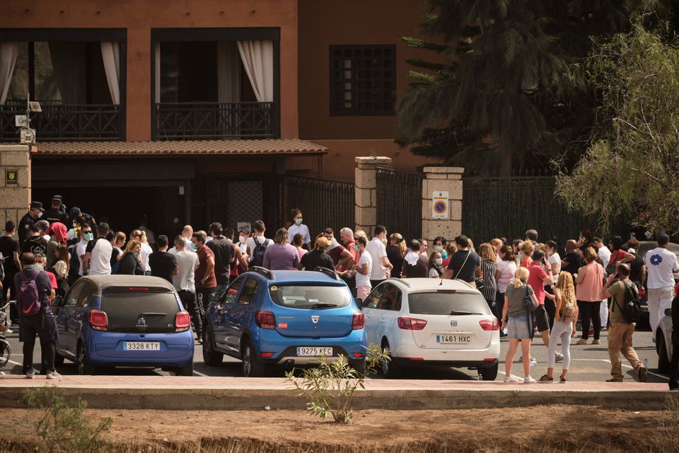 Hotel workers queue to get tested at the H10 Costa Adeje Palace hotel in the Canary Island of Tenerife.