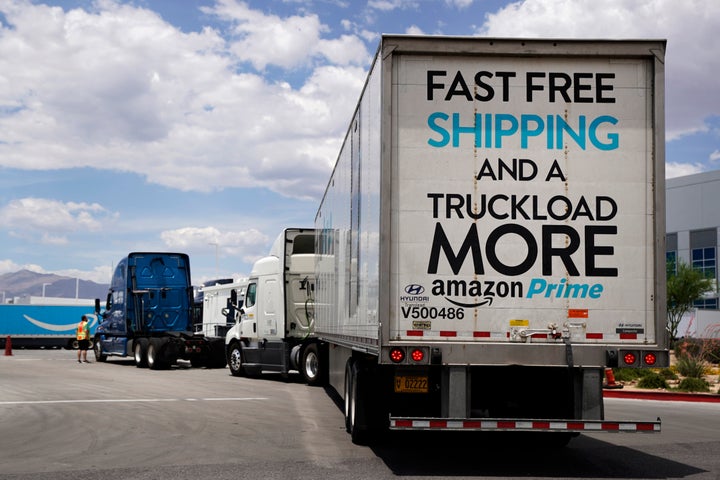 Trucks line up as security checks them into the Amazon regional distribution center last June in Las Vegas.