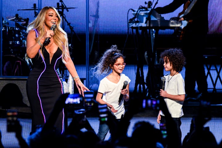 Mariah Carey performs with her kids Monroe Cannon and Moroccan Cannon during the the Caution World Tour in Atlanta, Georgia, in 2019.