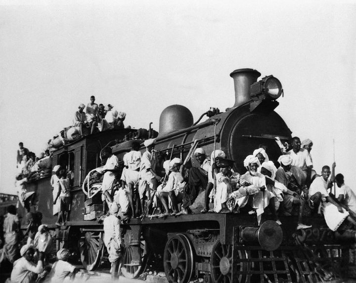 Hundreds of Muslim refugees jam inside and atop the engine and coaches of this train leaving the New Delhi area for Pakistan in September 1947. 
