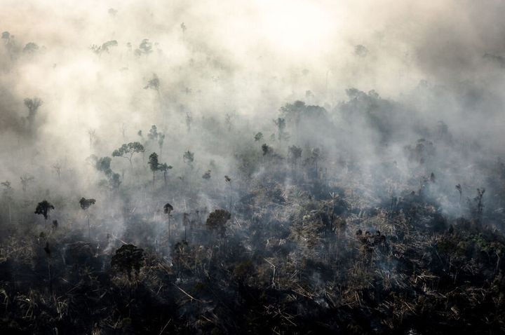 Smoke rises as a fires burn in the Amazon rainforest in this aerial photograph taken above the Candeias do Jamari region of Porto Velho, Rondonia state, Brazil, on Saturday, Aug. 24, 2019.
