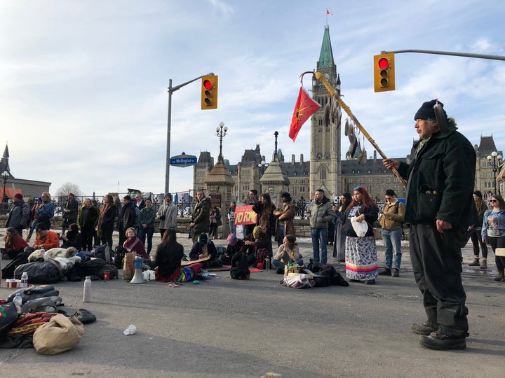 Protesters gather in the streets of Ottawa on Feb. 24, 2020 in support of a small group fighting construction of a natural gas pipeline on indigenous lands in British Columbia.