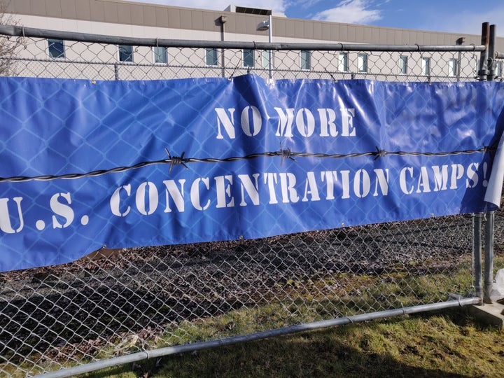 A sign outside the Northwest Detention Center in Tacoma, Washington, bluntly summarized the message of Sunday's demonstration