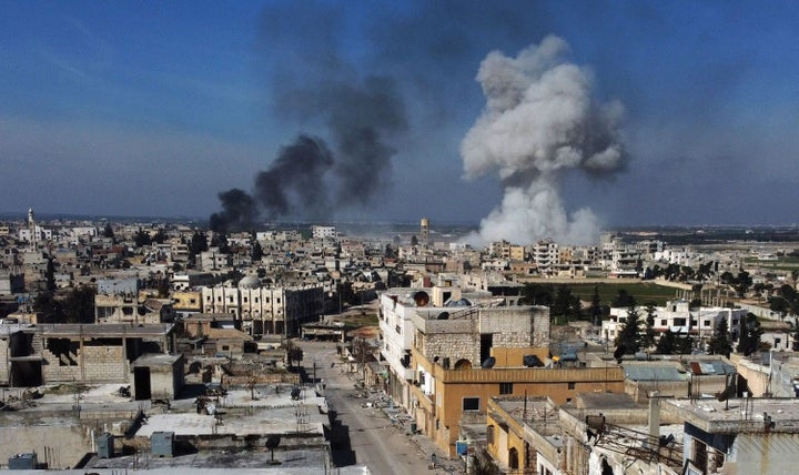 Smoke billows over the town of Saraqib in the eastern part of the Idlib province in northwestern Syria, following bombardment by Syrian government forces, on Feb. 27, 2020. 