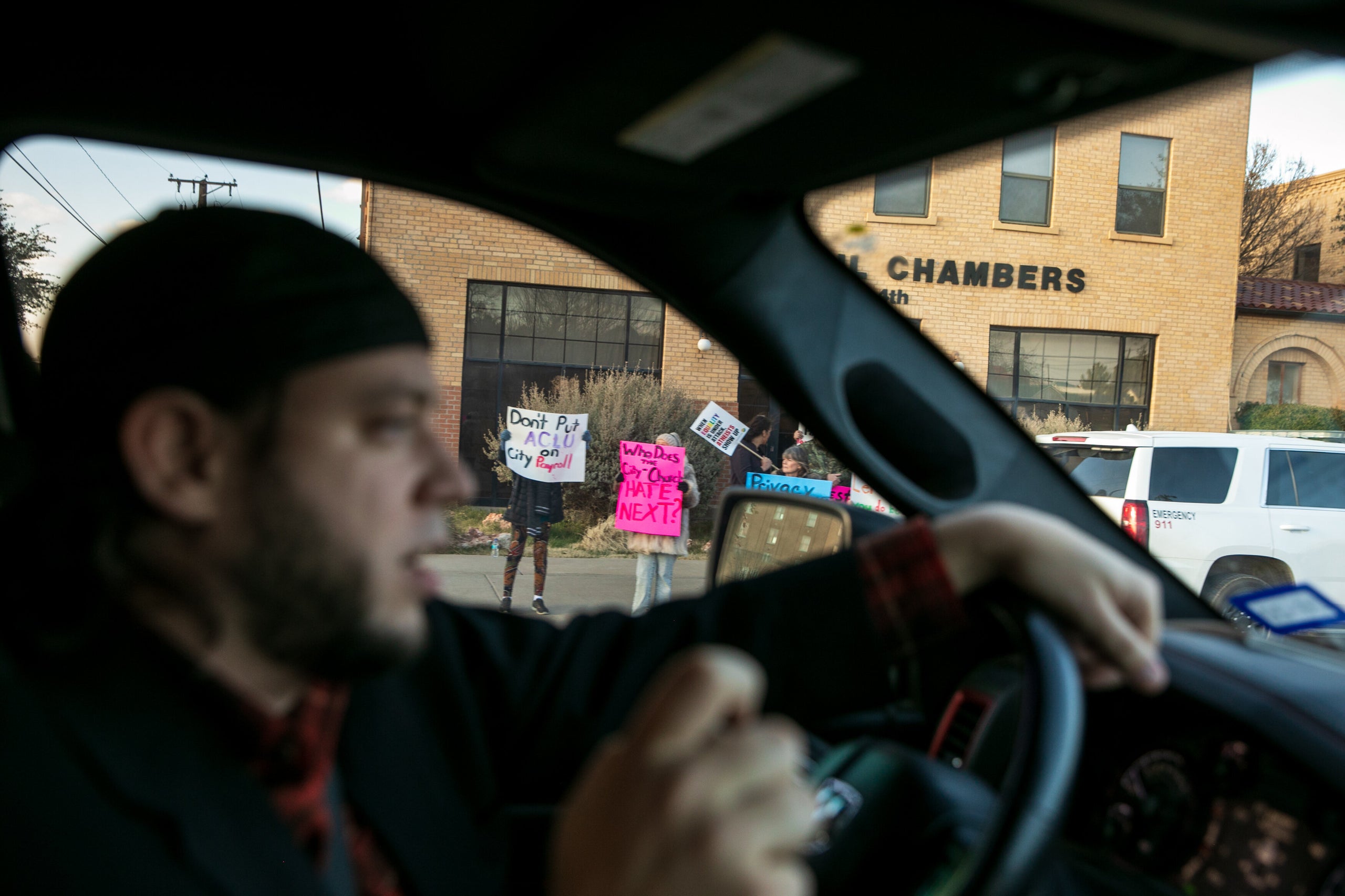 Mark Lee Dickson drives by a group of people protesting the proposed abortion ban.&nbsp;