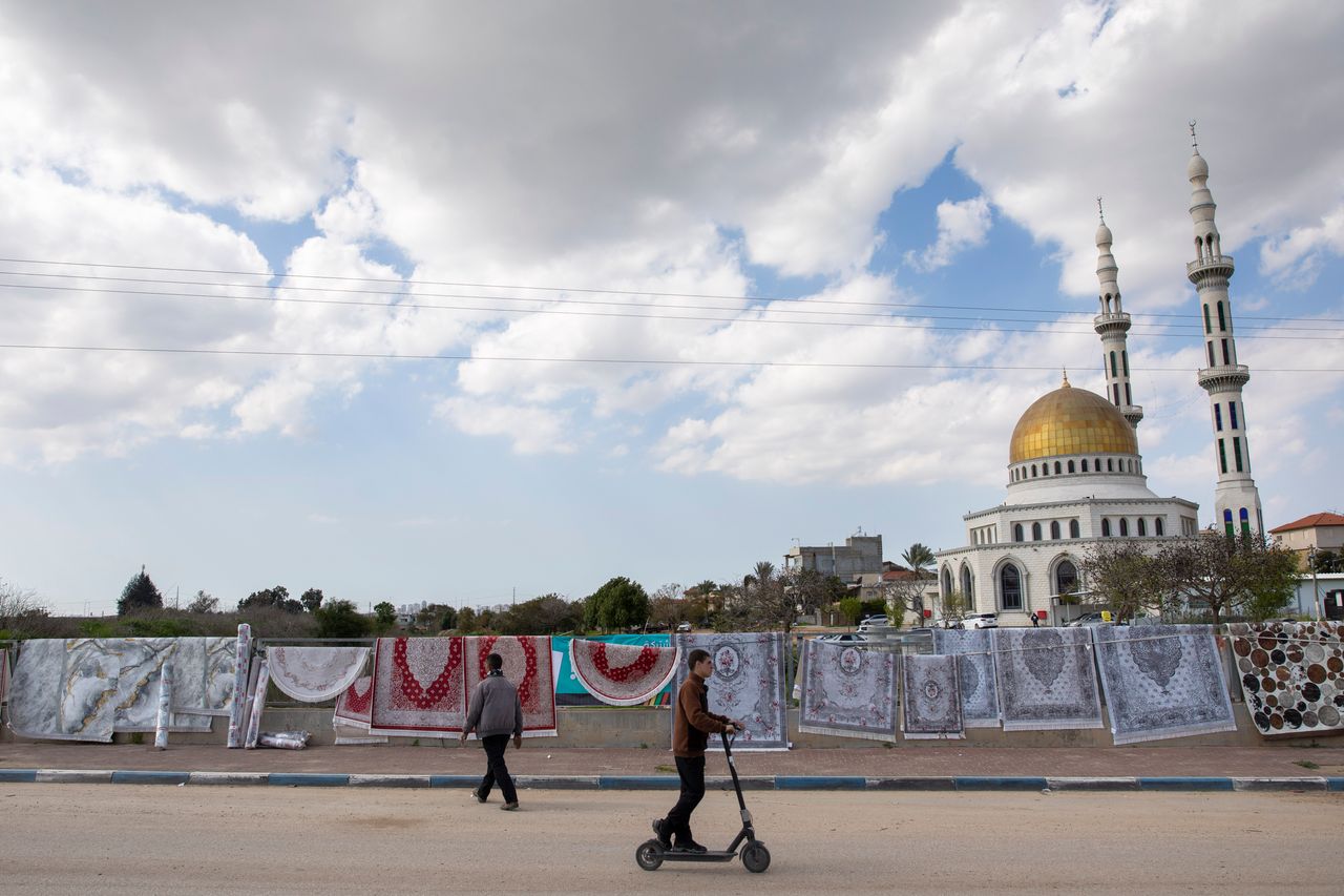 A man sells carpets at the Israeli Arab town of Jaljulia, Israel, Friday, Feb. 21, 2020. (AP Photo/Oded Balilty)