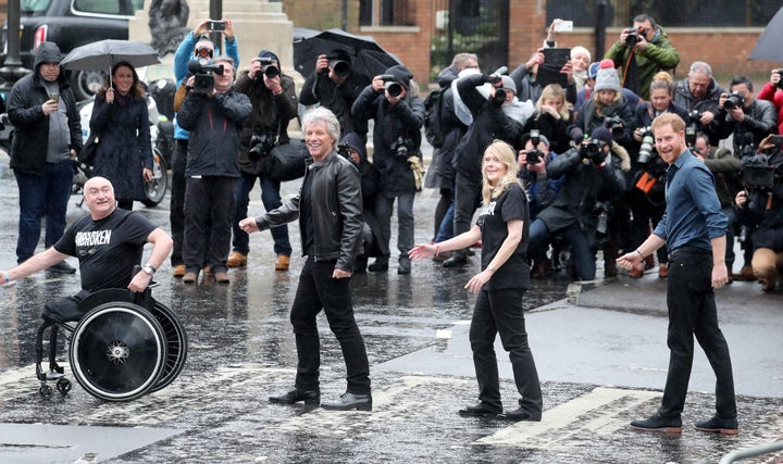 Prince Harry, Duke of Sussex (R), Jon Bon Jovi (second left) and members of the Invictus Games Choir pose on the crossing at Abbey Road Studios on Feb. 28, in London.