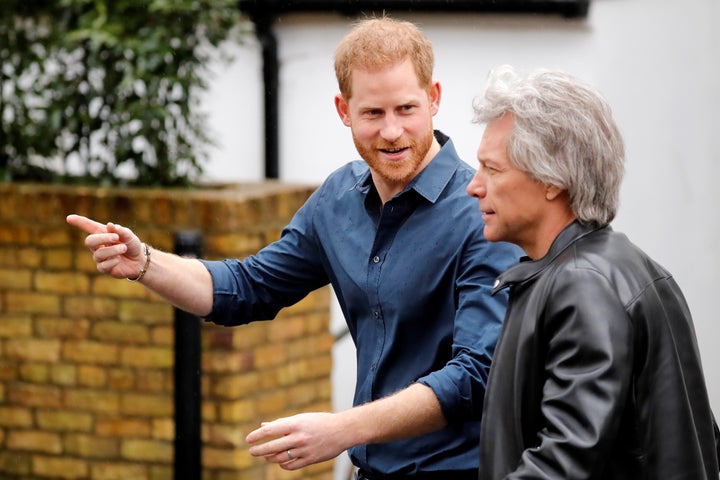 Harry and Bon Jovi, walk to recreate the famous Beatles pose on the zebra crossing outside the Abbey Road Studios.