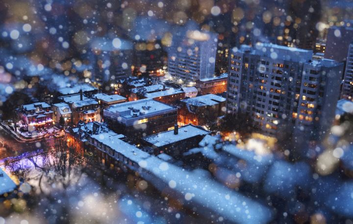 In this stock photo, an aerial view of houses and apartments in Toronto can be seen through a tilt-shift "miniaturization" effect.
