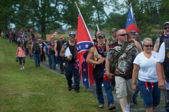 Activists holding Confederate flags gather at the Gettysburg National Military Park on July 1, 2017, in Gettysburg, Pennsylvania. The U.S. park service issued protest permits for three groups, including Sons of Confederate Veterans, on the 154th anniversary of the battle.