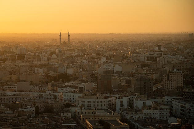 The sun rises over Tripoli, Libya, Friday, Feb. 28, 2020. (AP Photo/Felipe Dana)