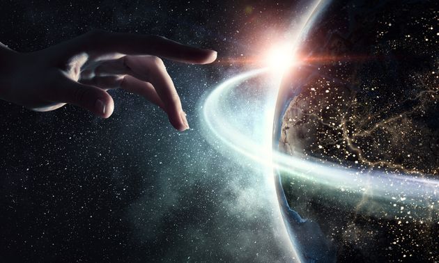 Close of human hand touching with finger Earth planet. Elements of this image are furnshed by NASA