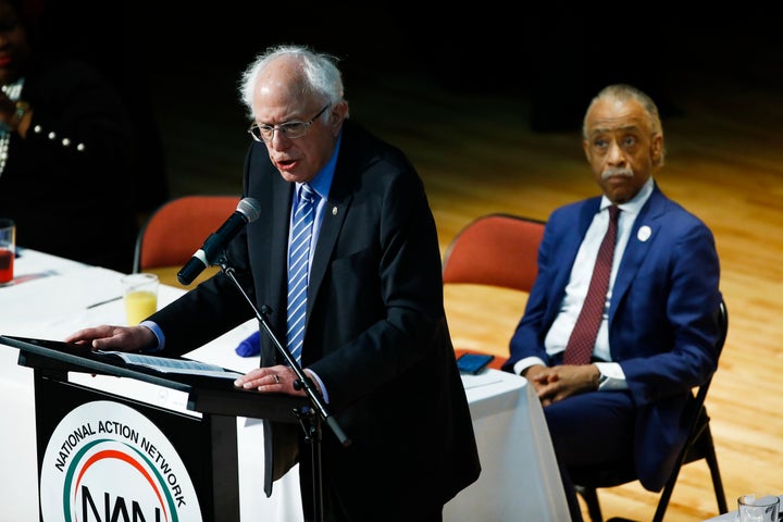 The Rev. Al Sharpton listens to Democratic candidate Bernie Sanders at the National Action Network South Carolina Ministers'