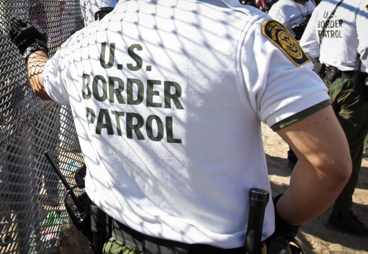 A U.S. Border Patrol agent at the border wall between Juárez, Mexico, and Sunland Park, New Mexico.