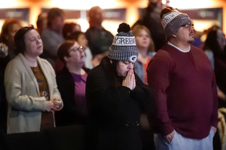 People attend a prayer vigil for victims of the Molson Coors brewery shooting at the Ridge Community Church on Feb. 27, 2020, in Milwaukee.