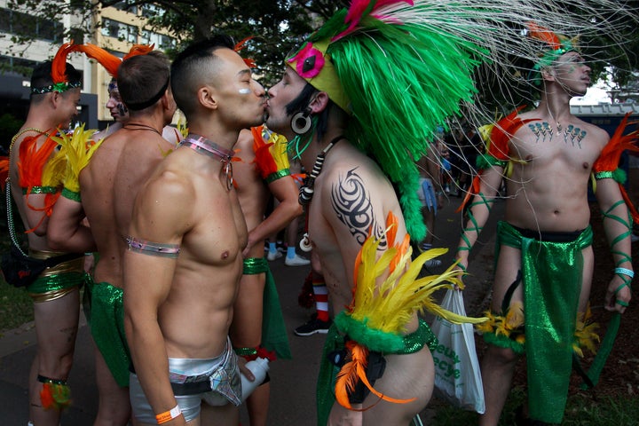 Parade goers kiss during the 2020 Sydney Gay & Lesbian Mardi Gras Parade on February 29, 2020 in Sydney, Australia. 